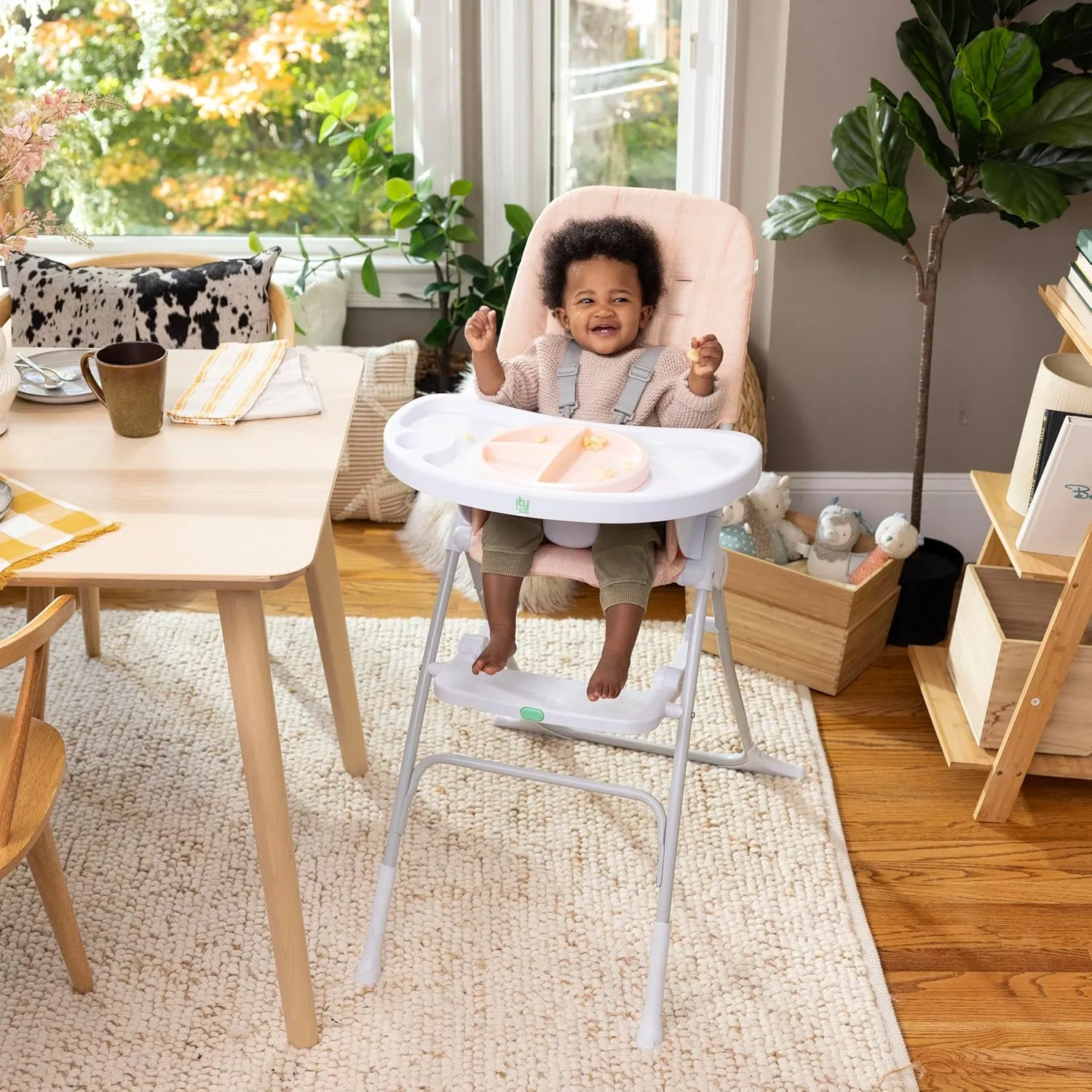 Ingenuity Sun Valley Compact Folding Baby High Chair, Food-Grade Safe Plate, Safety Harness, for Ages 6 Months and Up, Unisex - Pink
